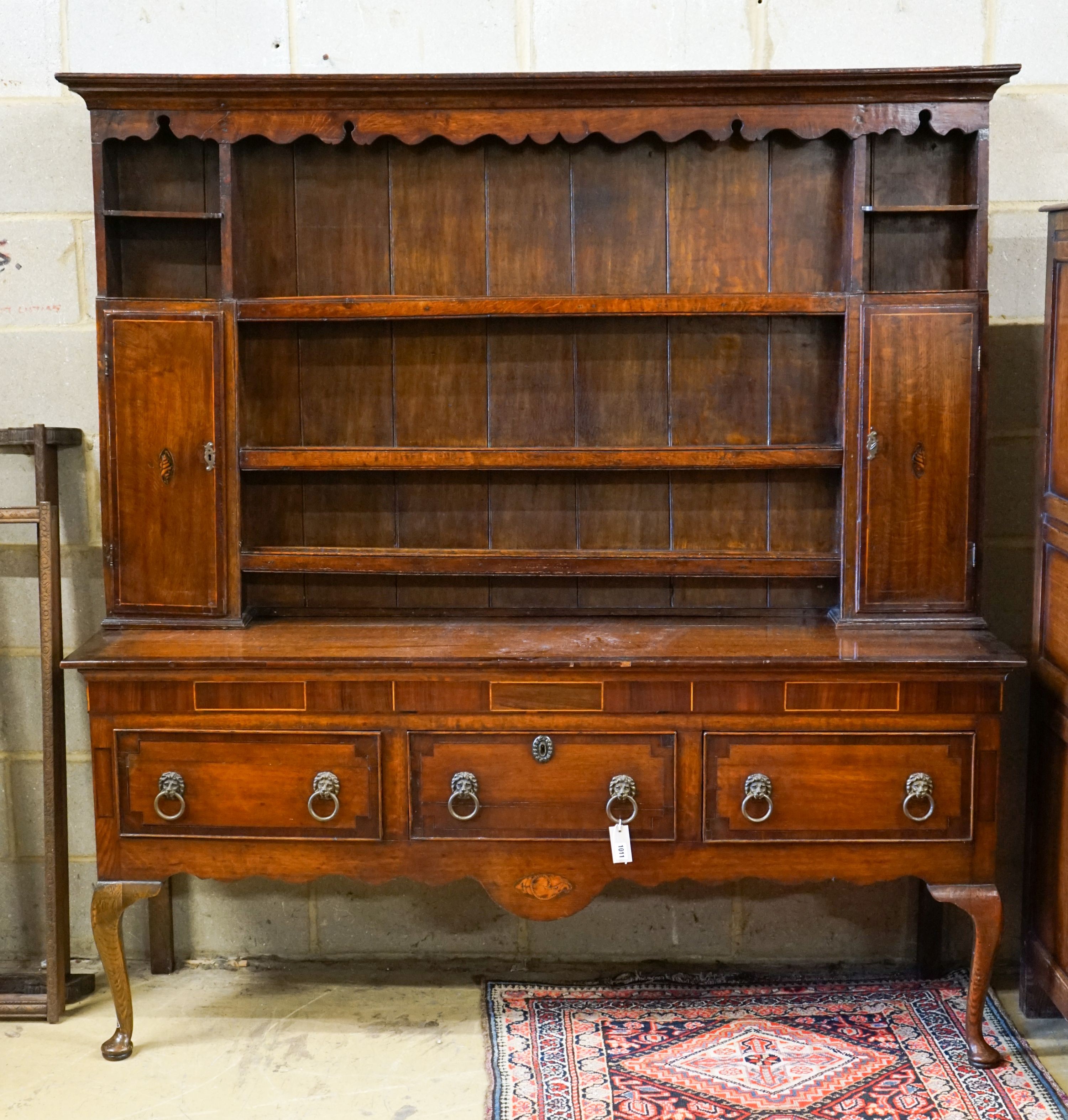 An 18th century oak and mahogany crossbanded dresser